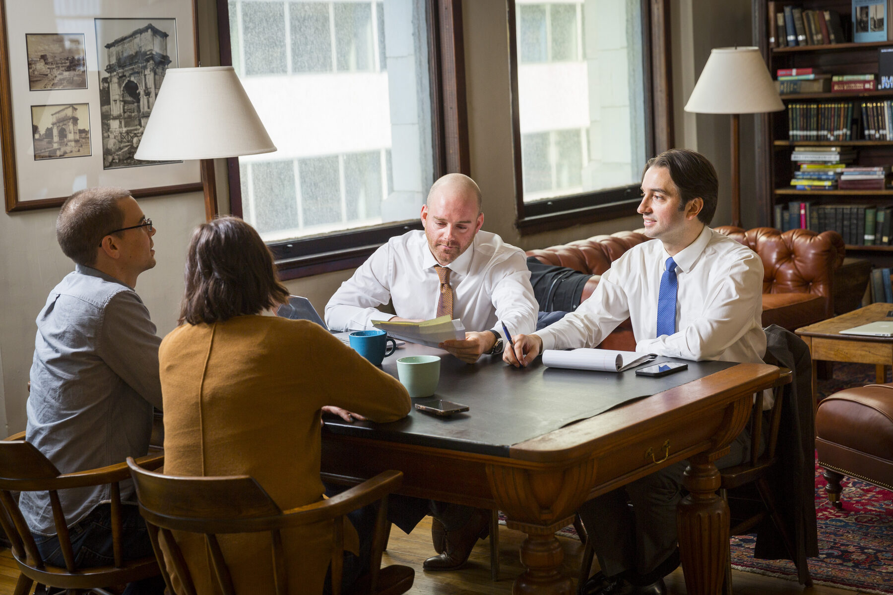 Spivak & Sakellariou meeting with a client